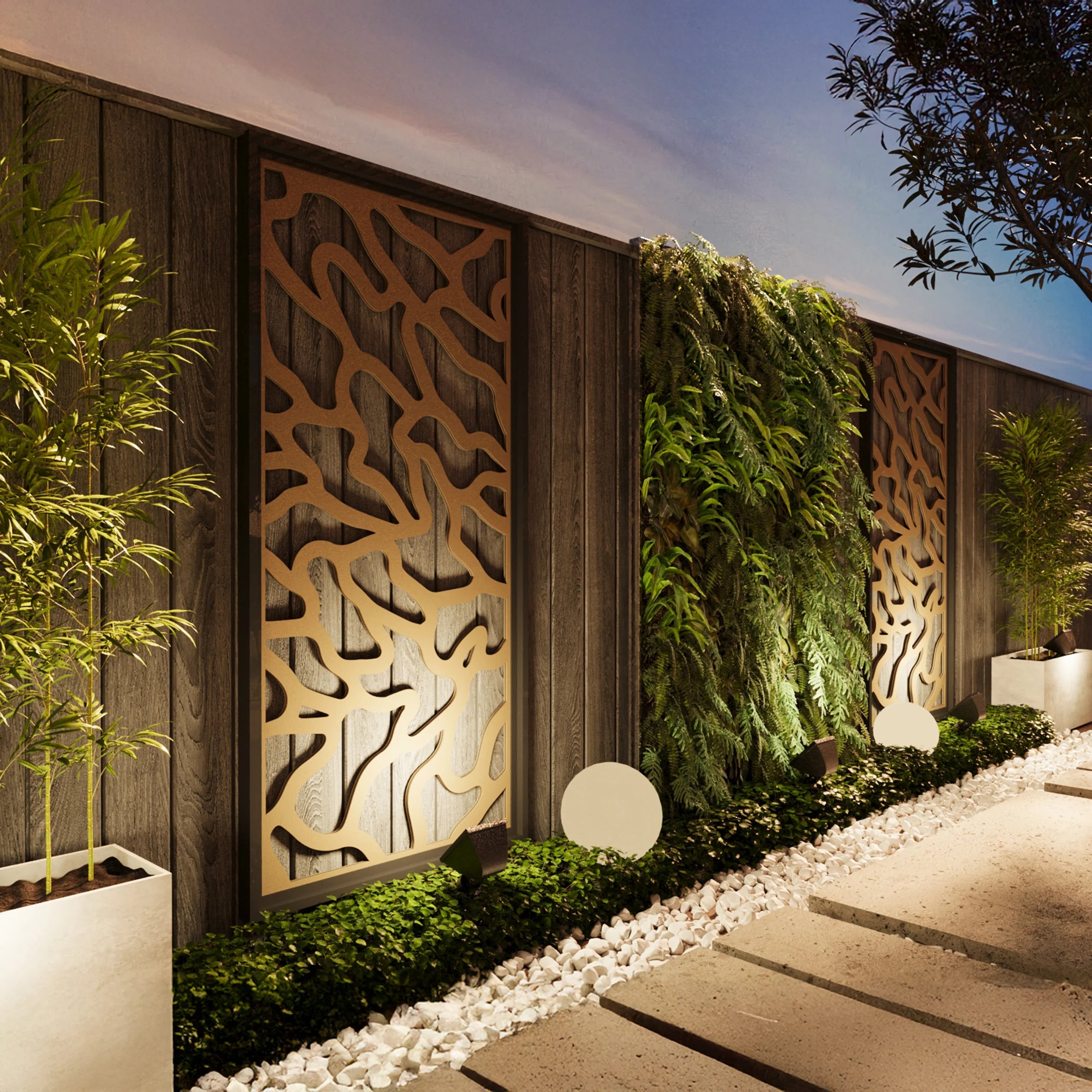 Decorative wooden outdoor panels with foliage on a wall, illuminated pathway, and plants.